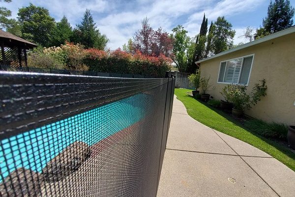 black-mesh-pool-fence-installed-Fredericksburg-Texas Pool Fence Fredericksburg, Texas
